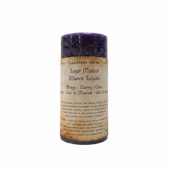 Handcrafted dark purple scented spell candle made with orange, nutmeg and clove, and used for success in all legal matters